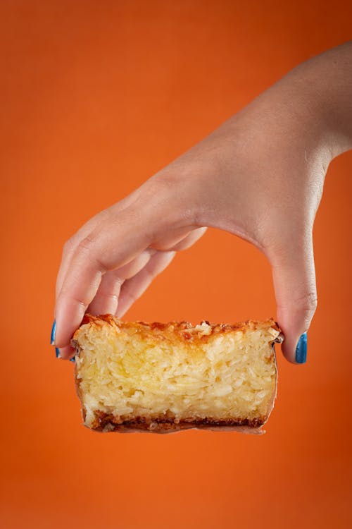 Close-up of Woman Holding a Piece of Cake 