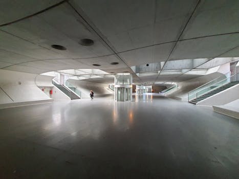 A spacious view of the modern interior of Oriente Station in Lisbon, Portugal.