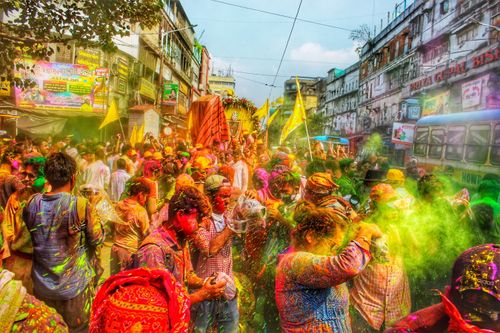 Free Crowd celebrating Holi festival in Kolkata with colorful powders. Stock Photo