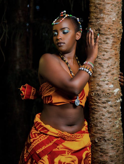 Woman Leaning on Tree Trunk