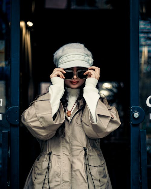 Woman in Hat, Sunglasses and Trench Coat