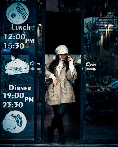 Woman in Hat and Jacket Leaving Restaurant