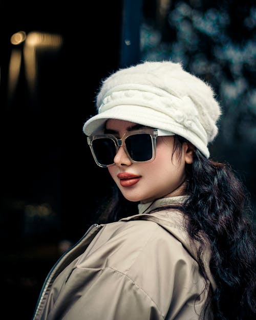 Model in a White Cap and a Beige Jacket 