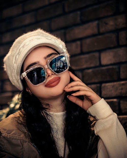 Portrait of Woman in Hat and Sunglasses