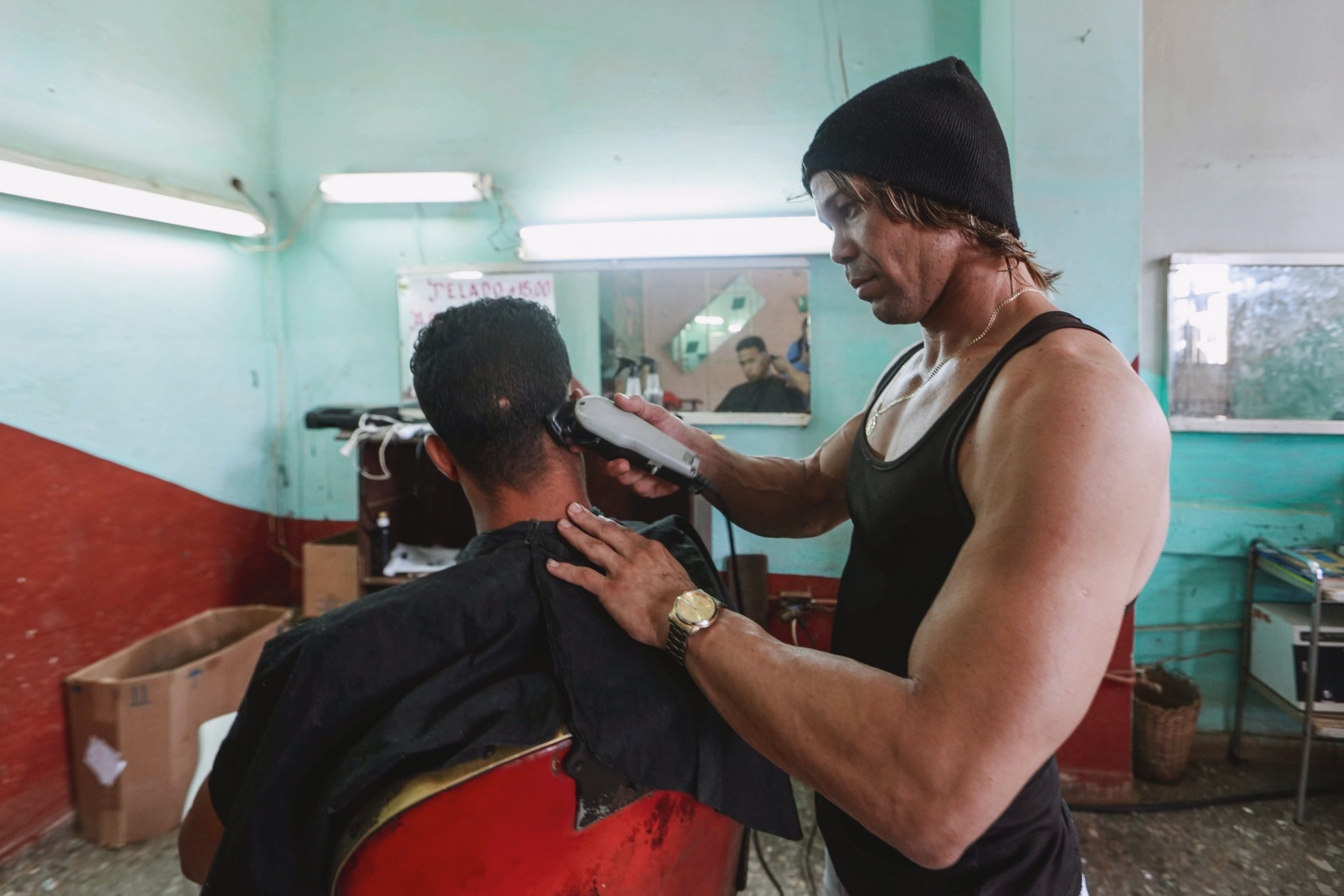 Professional barber working with tools