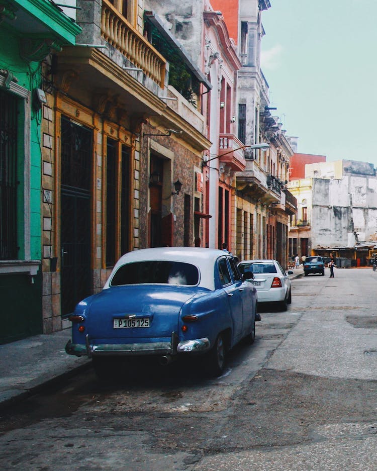 Old Ford Custom Deluxe Parked On A Street Of Havana