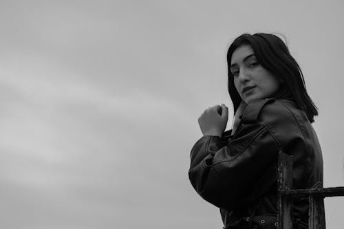 Woman Standing in Leather Jacket