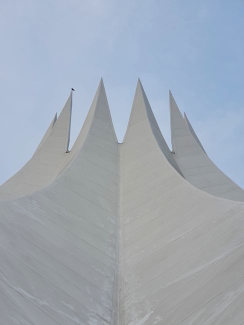 Close-up of the modern and iconic Tempodrom architecture in Berlin, highlighting its dramatic peaks.