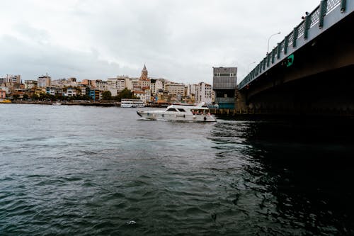 Motor Yacht under Galata Bridge in Istanbul