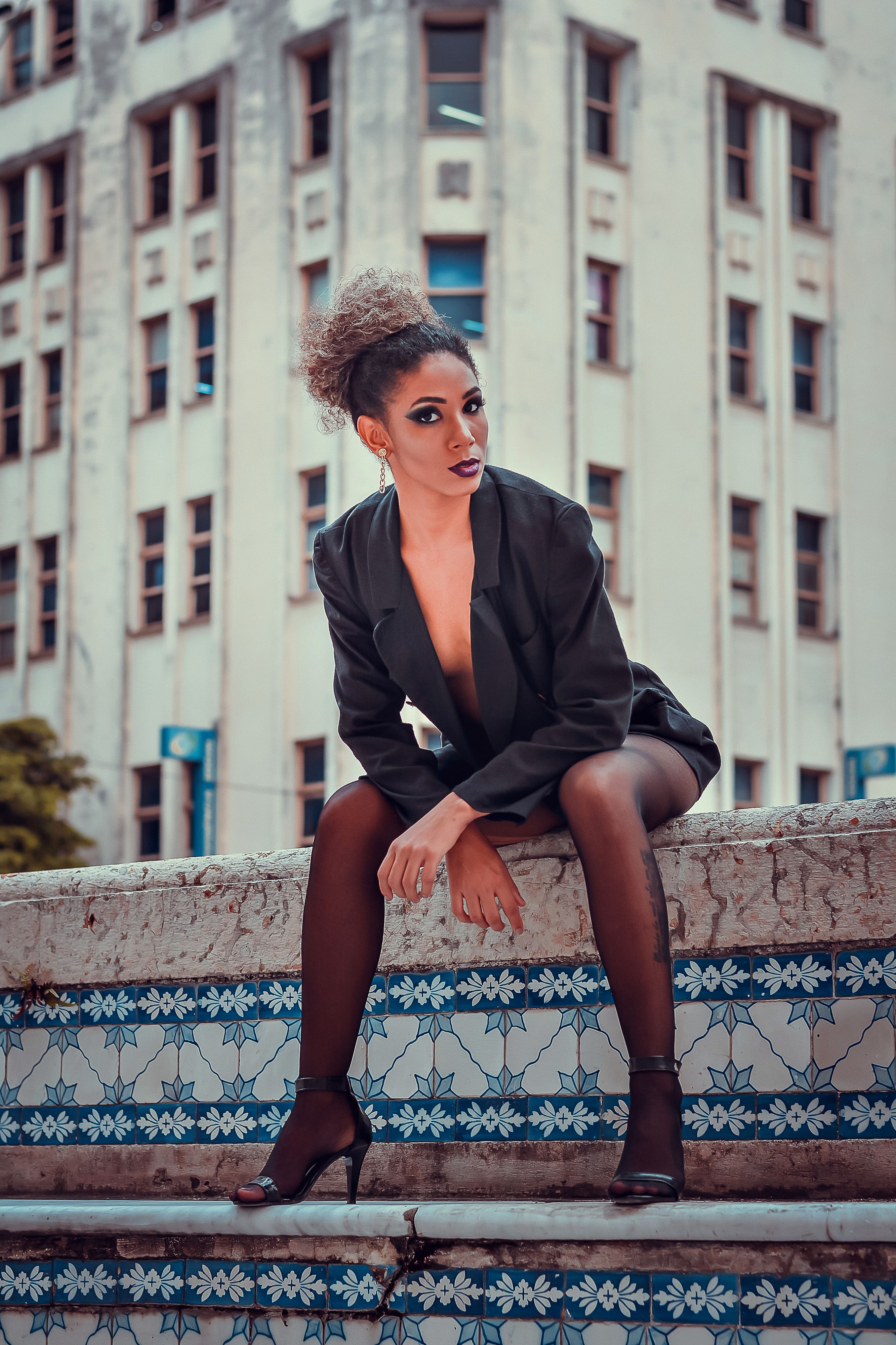 A Woman Wearing a Black Dress and High Heels  Free Stock Photo