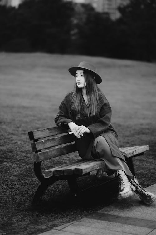 Portrait of Woman Wearing Hat Sitting on Bench