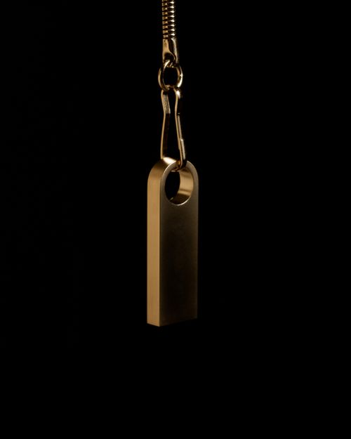 Free Close-up shot of a metallic zipper on a black background, highlighting its sleek design. Stock Photo