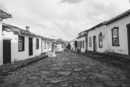 Free A black and white photo of a cobblestone street in the historic city of Tiradentes, Brazil. Stock Photo