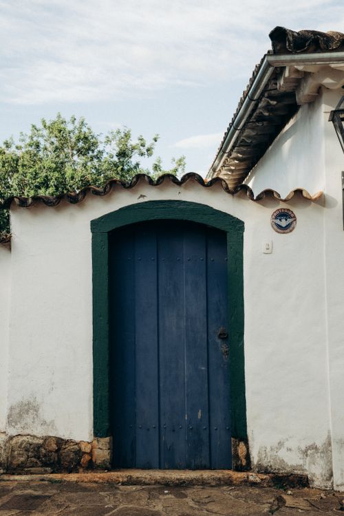 Free A rustic blue door on a traditional colonial house in Tiradentes, Brazil, showcasing unique architecture. Stock Photo