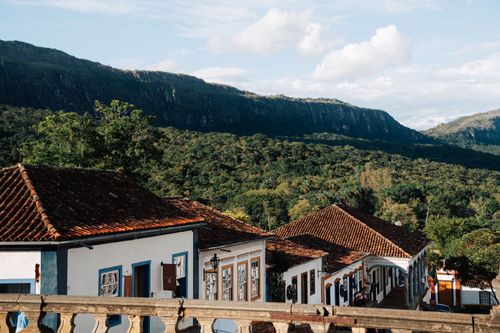 Free Charming colonial architecture with lush mountainous backdrop in Tiradentes, Minas Gerais, Brazil. Stock Photo