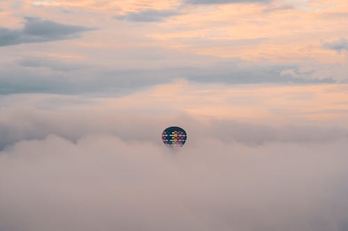 Hot Air Balloon among Dense Clouds