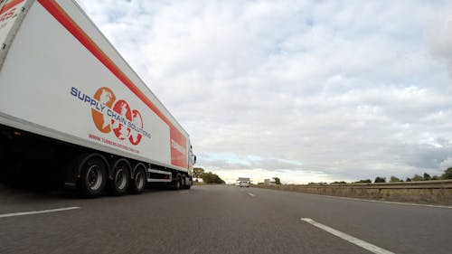 White Trailer Truck on Concrete Road