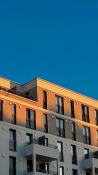 Contemporary Berlin apartment building under a clear blue sky.