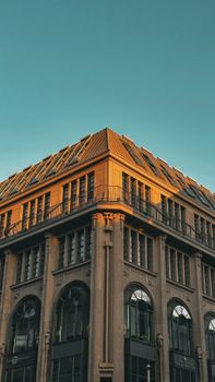 Elegant building facade in Berlin showcasing classic architecture with sunset hues.