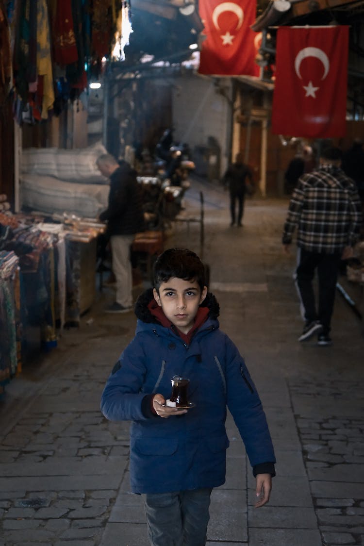 Boy Walking In Narrow Street In Turkey 