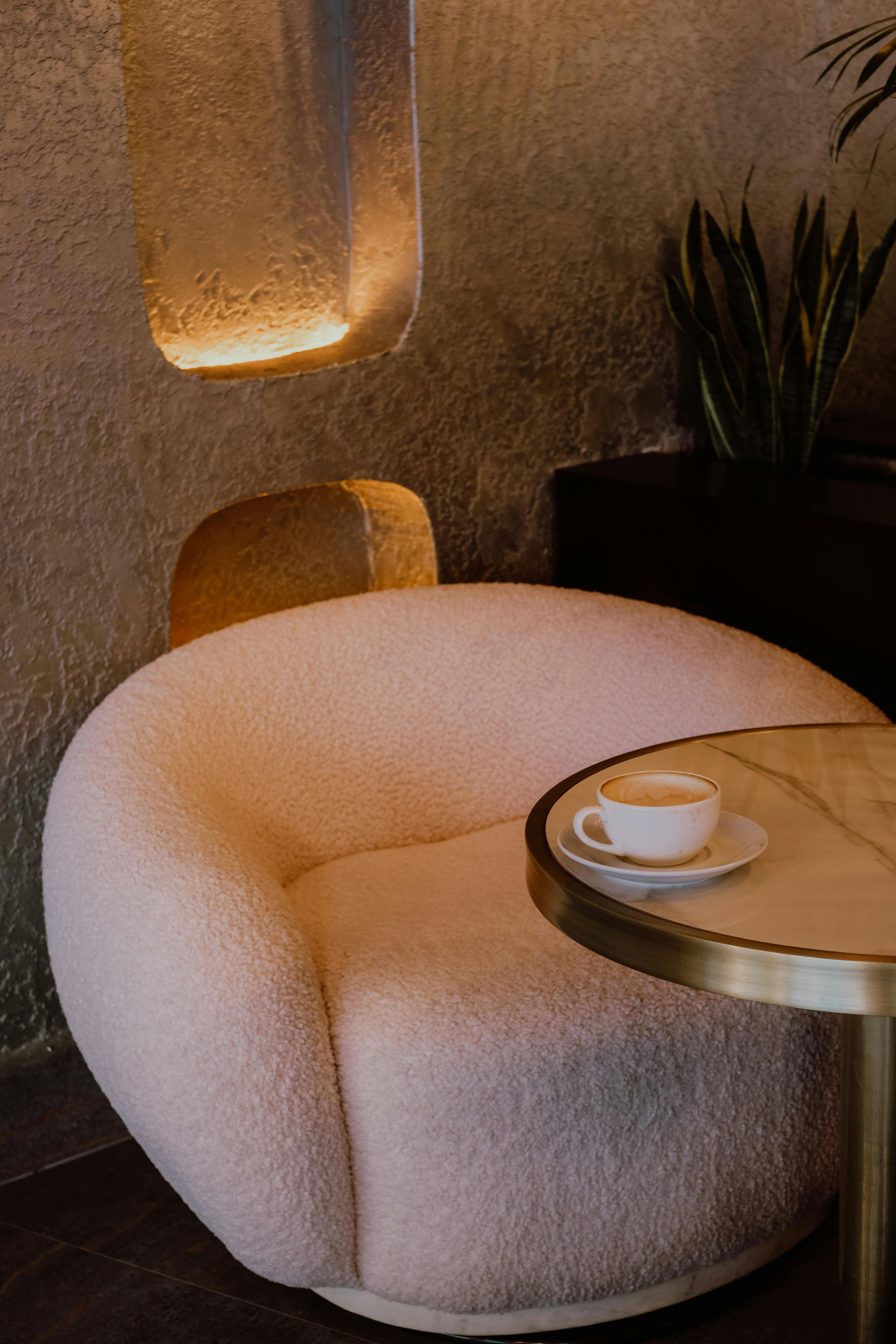 Pouf and Table in a Coffee Shop · Free Stock Photo