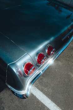 Rear view of a classic Chevrolet Impala highlighting vintage taillights.