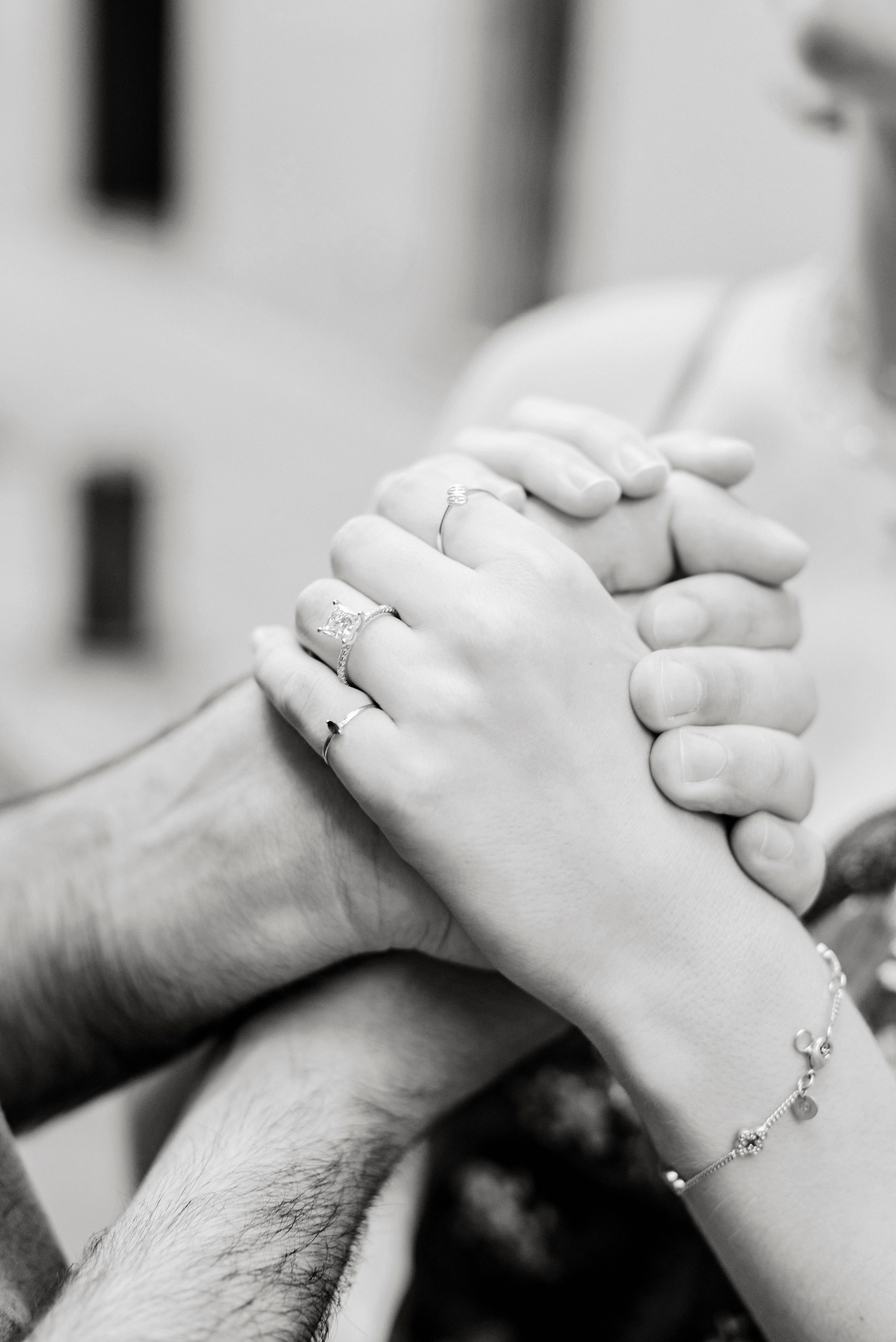 Black and white photo of a couple holding hands · Free Stock Photo