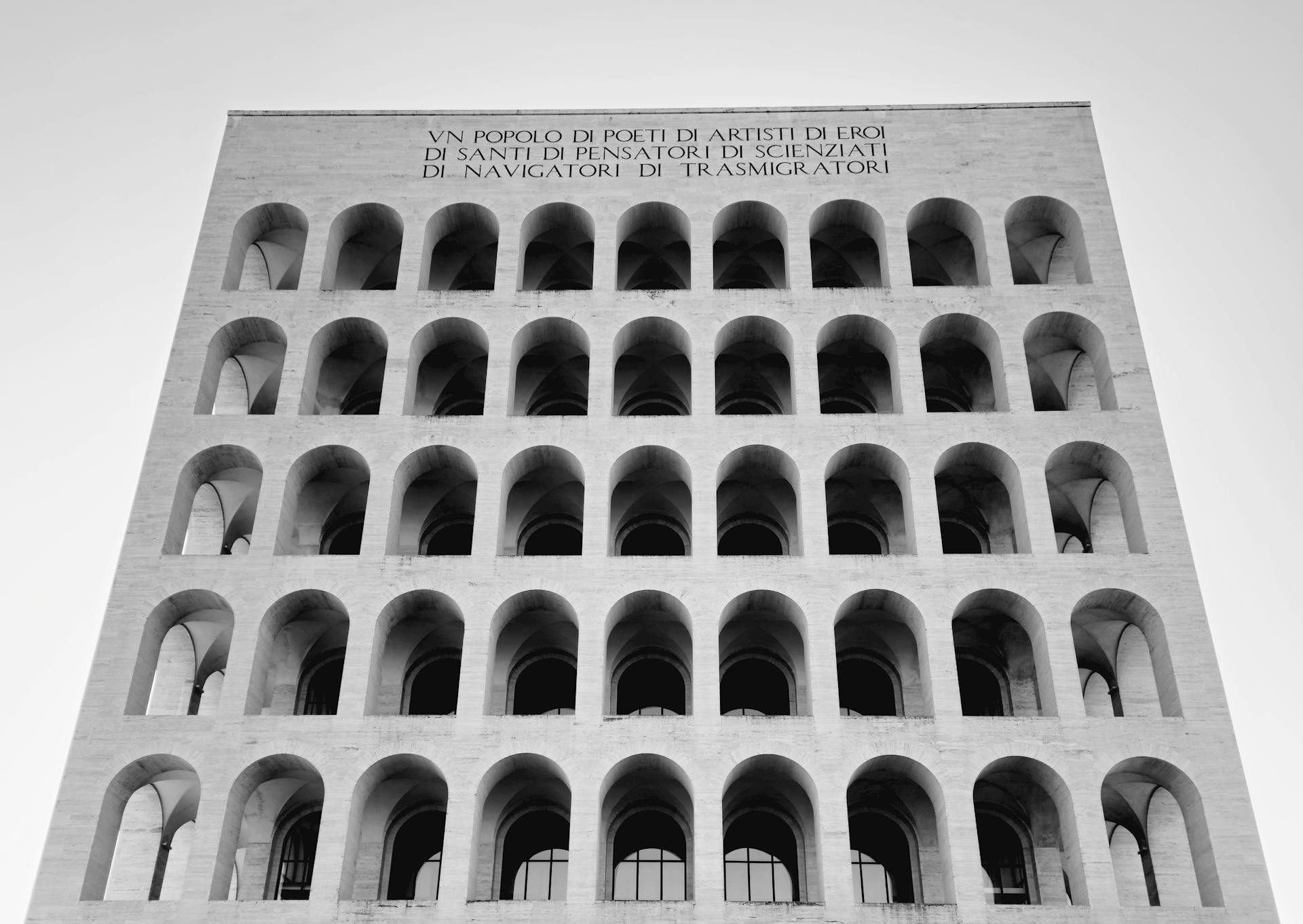 Black and white photo of the iconic Palazzo della Civiltà Italiana in Rome, showcasing its unique architecture.