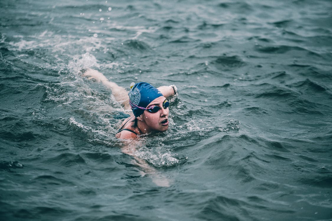 Free Person Swimming in Ocean Stock Photo