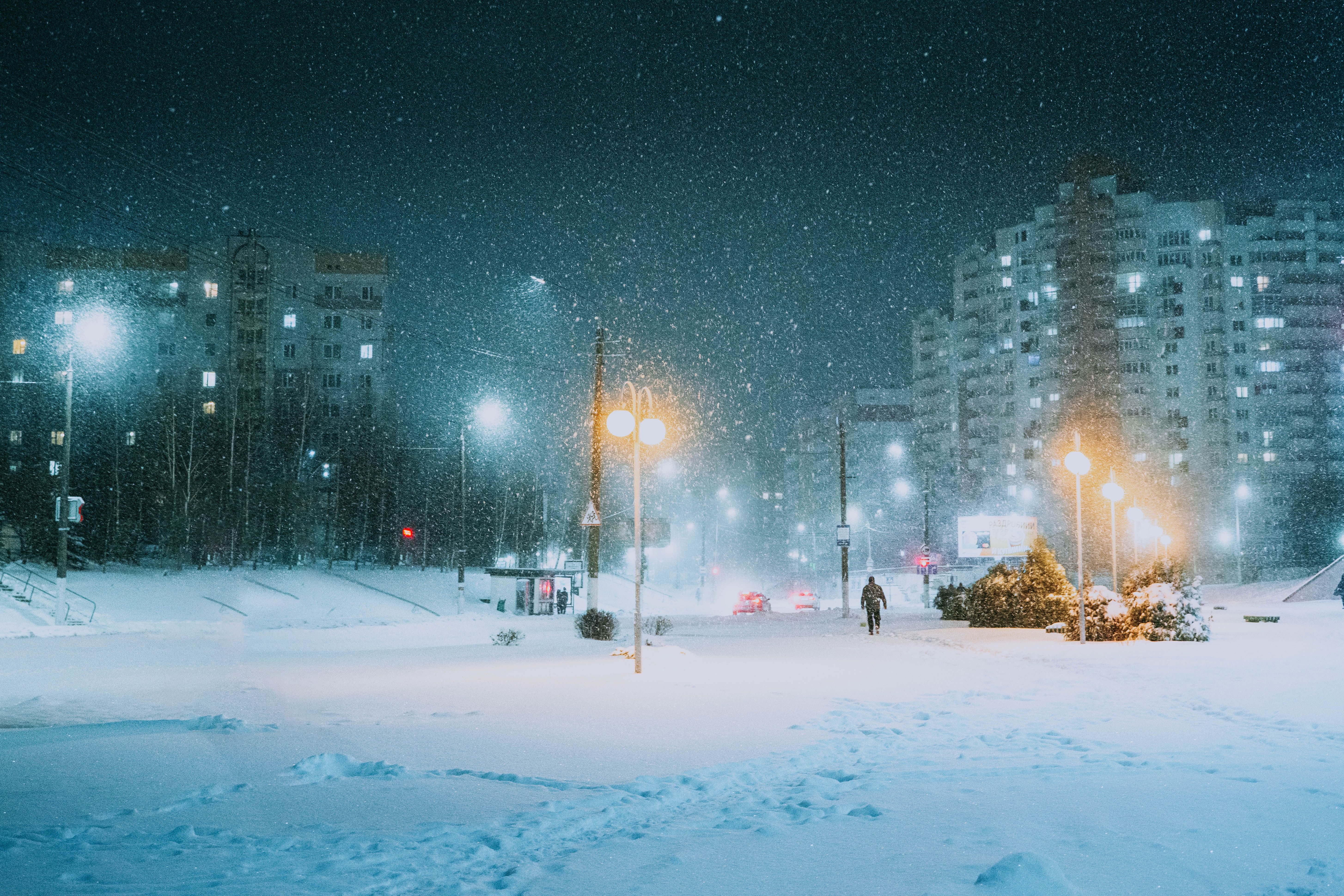 Vitebsk city at night during a snowfall in December near a shopping ...