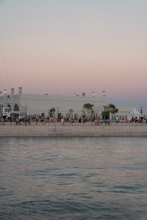 People on Sea Shore in Town