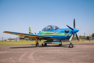 Vibrant Brazilian aircraft with blue livery on a sunny tarmac day.