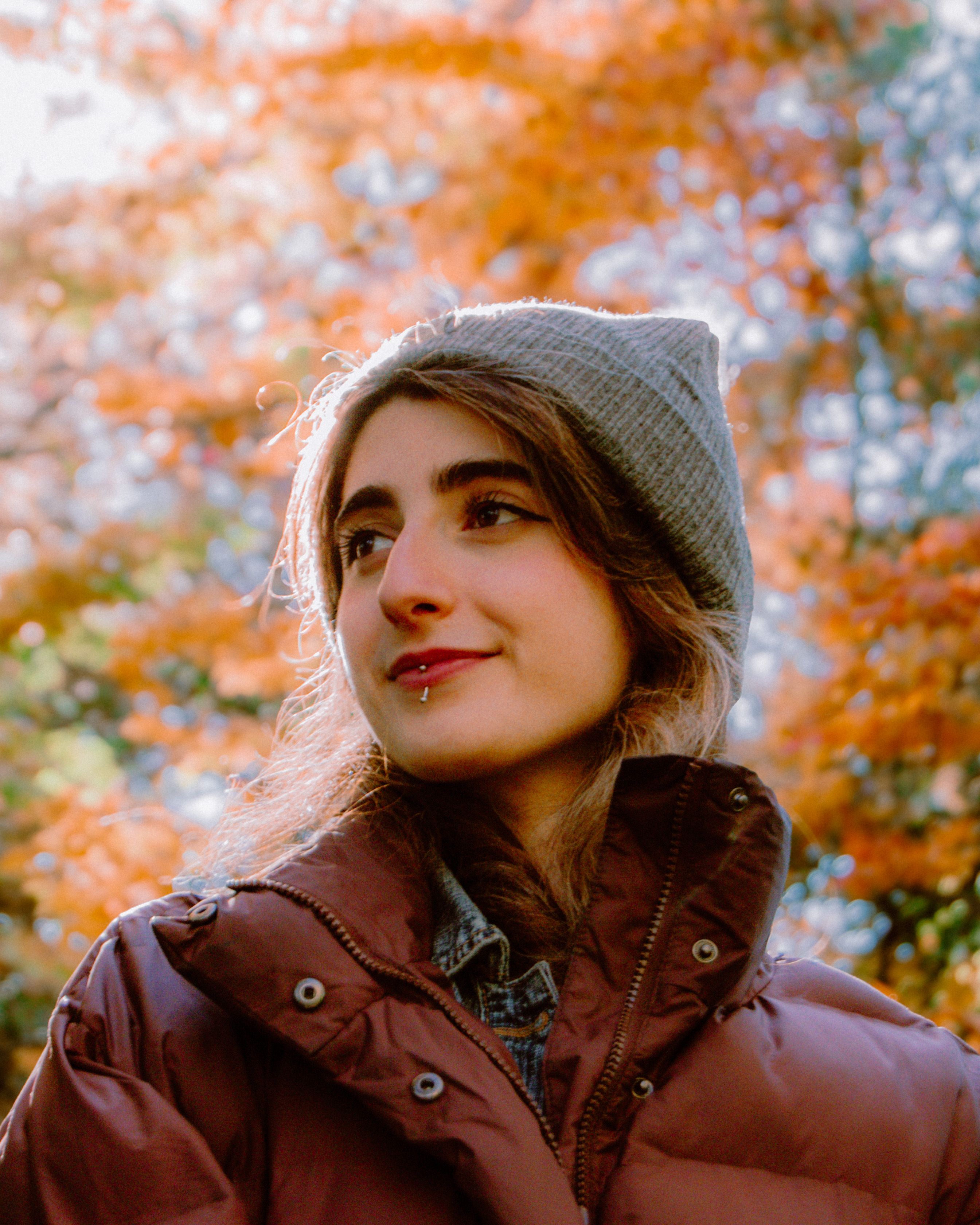 Smiling woman in a hat outdoors