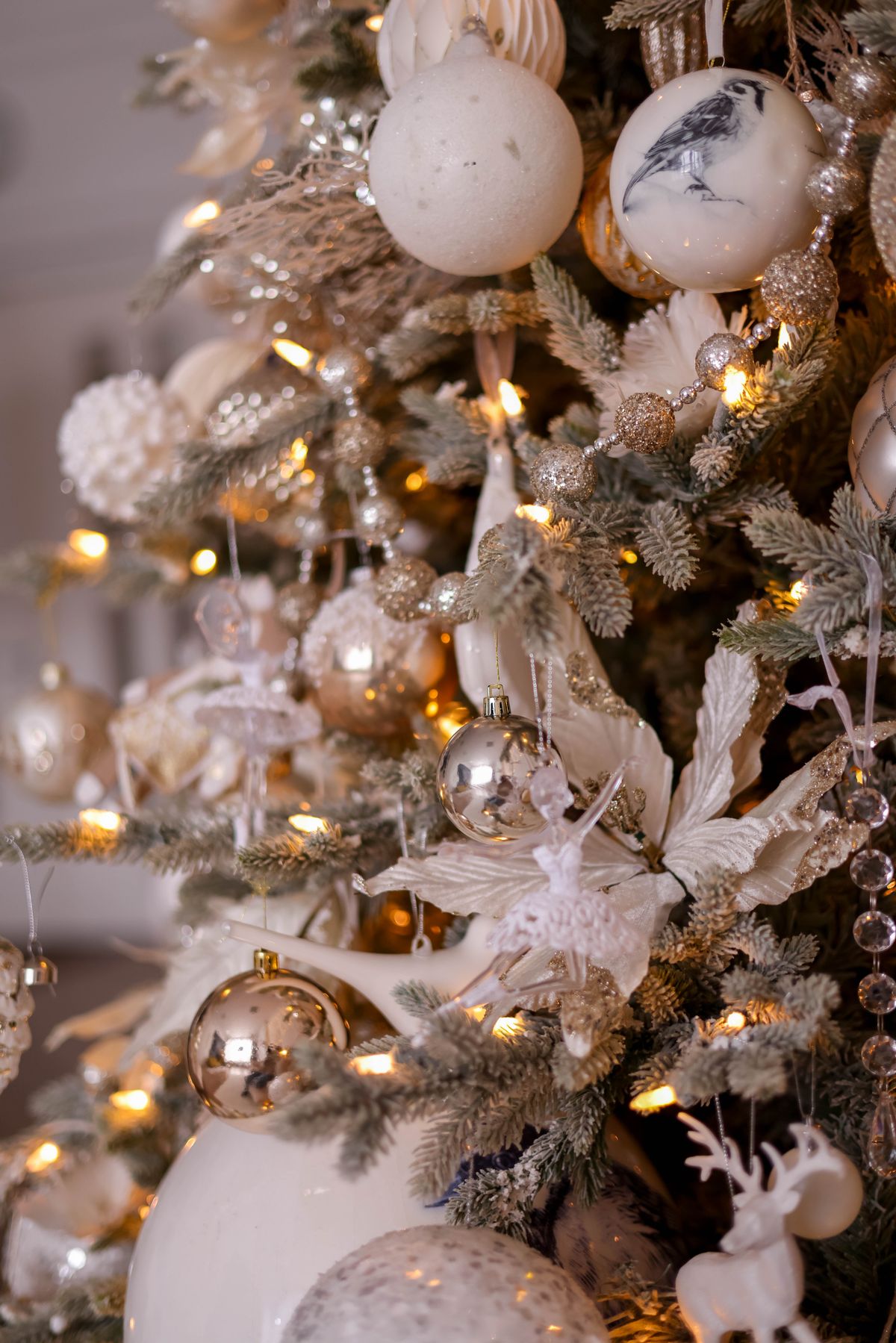 Regal Christmas tree in jewel tones with gold and white decorations