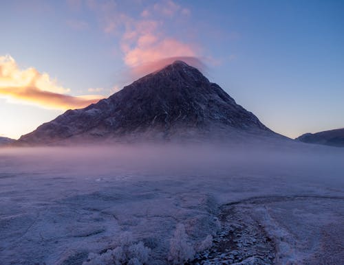 Snow and Cloud under Volcano at Sunset