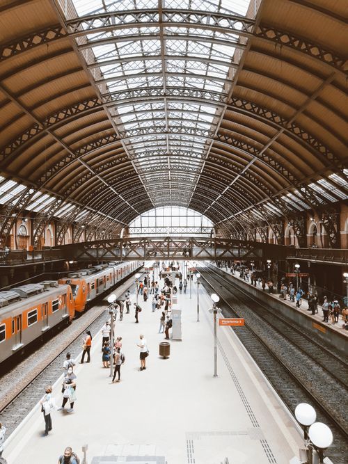 Free A bustling scene at São Paulo's Luz Station with commuters and trains. Stock Photo