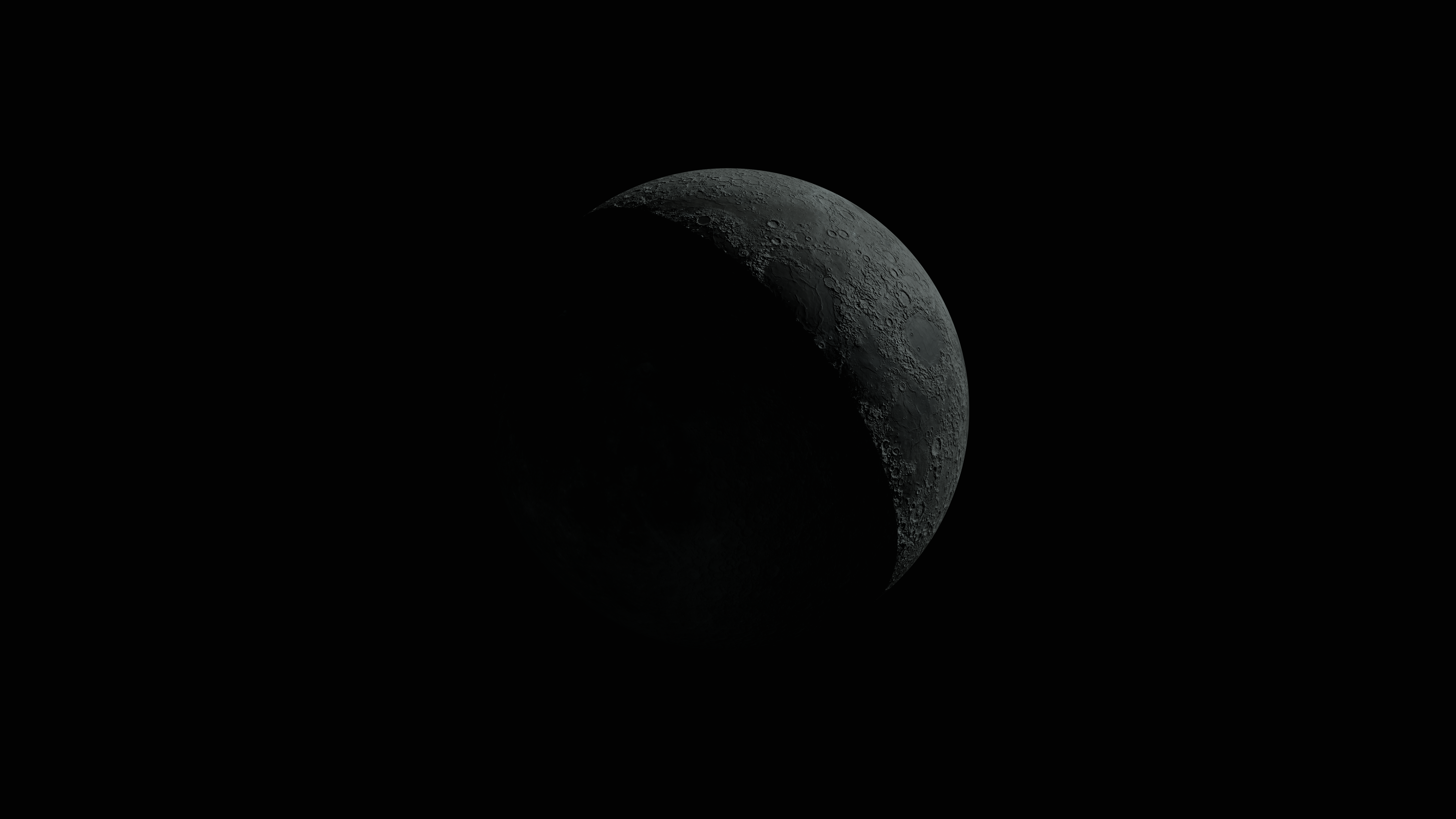 Crescent moon with detailed surface against a dark sky, offering celestial intrigue.