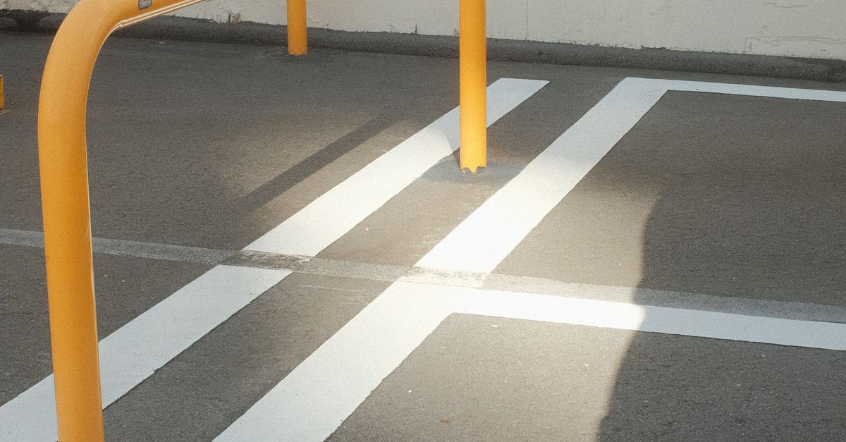 Parking Railing Work Railing in a Parking Lot · Free Stock Photo