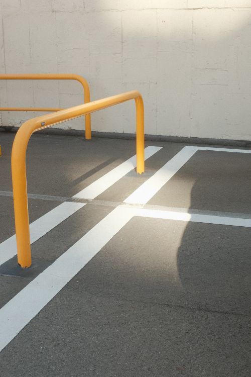 Parking Railing Work Railing in a Parking Lot · Free Stock Photo