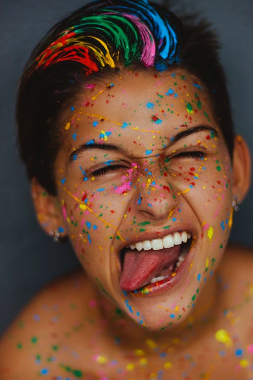 Woman's Face With Color Splatters