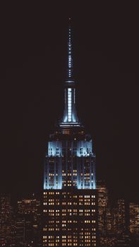 Stunning night view of the illuminated Empire State Building in New York City.