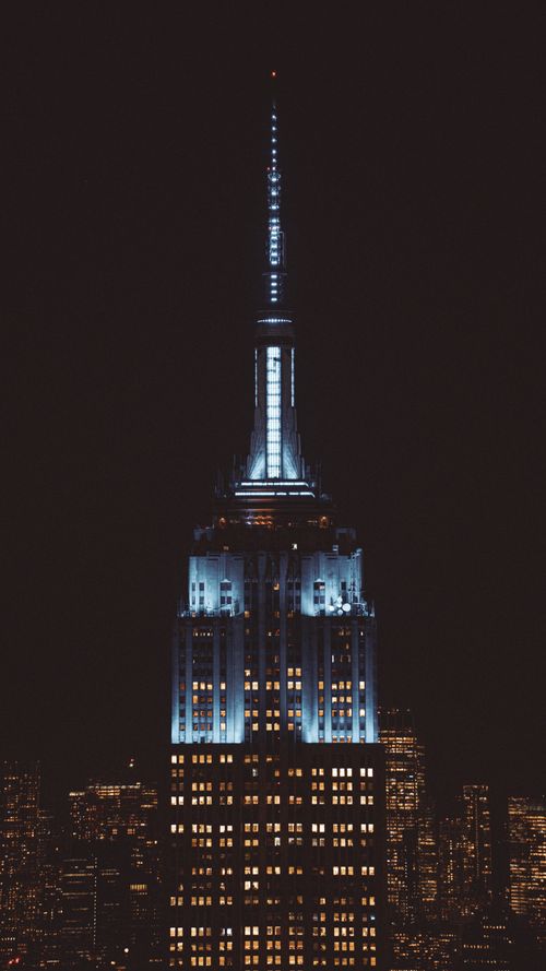 Free Stunning night view of the illuminated Empire State Building in New York City. Stock Photo