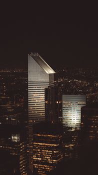 A breathtaking aerial view of New York City skyscrapers at night, capturing the vibrant urban landscape and iconic architecture.