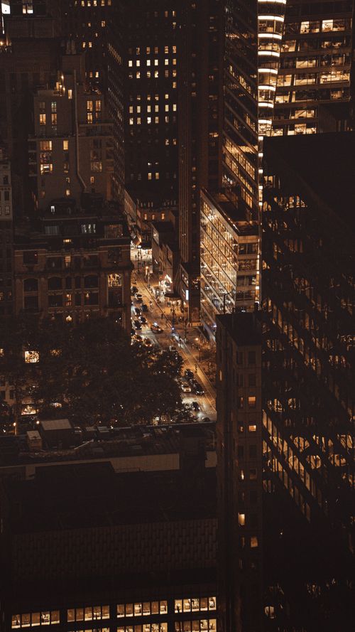 Free A breathtaking aerial view of New York City at night, showcasing illuminated skyscrapers and bustling streets. Stock Photo