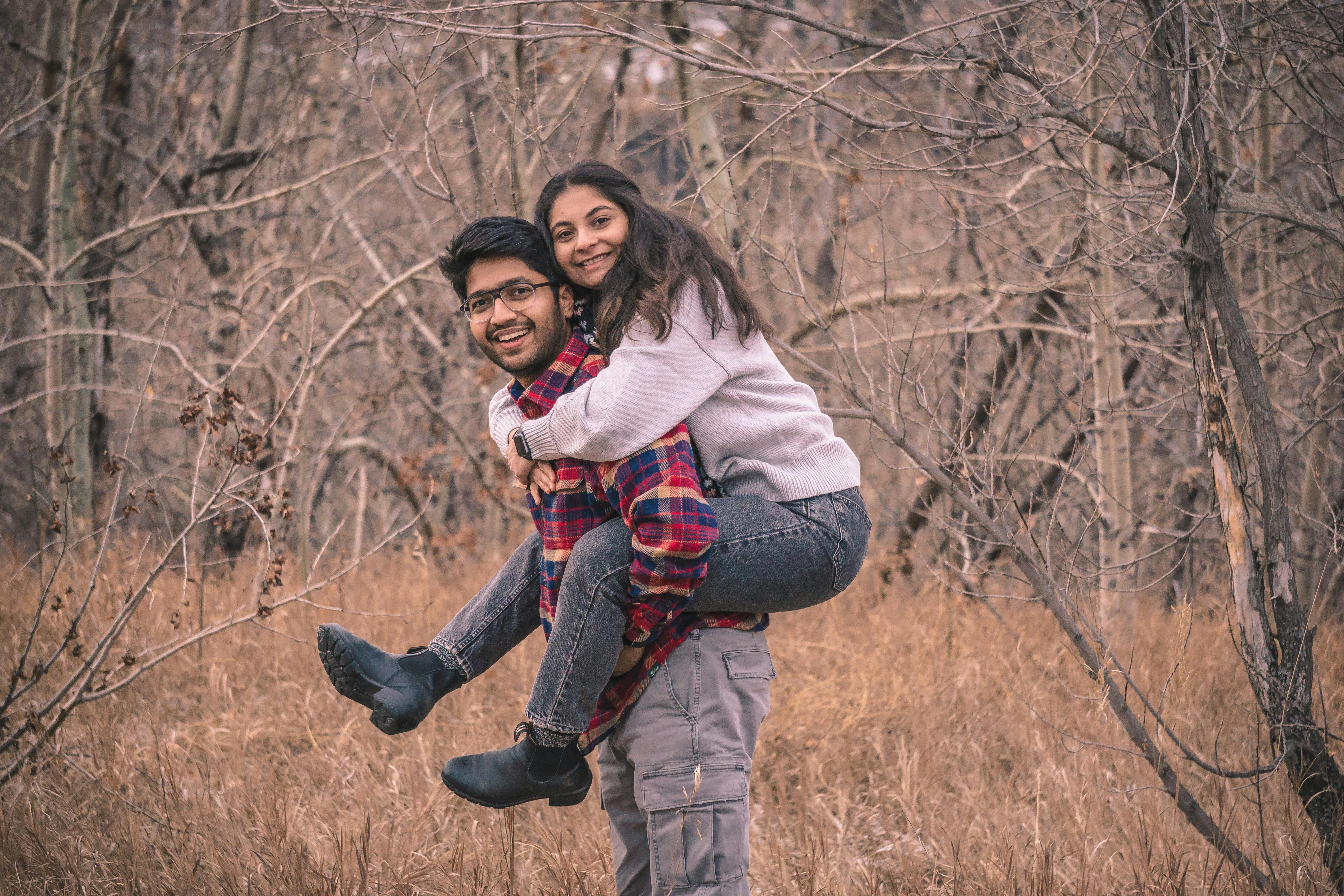 Smiling Woman Sitting on Man · Free Stock Photo