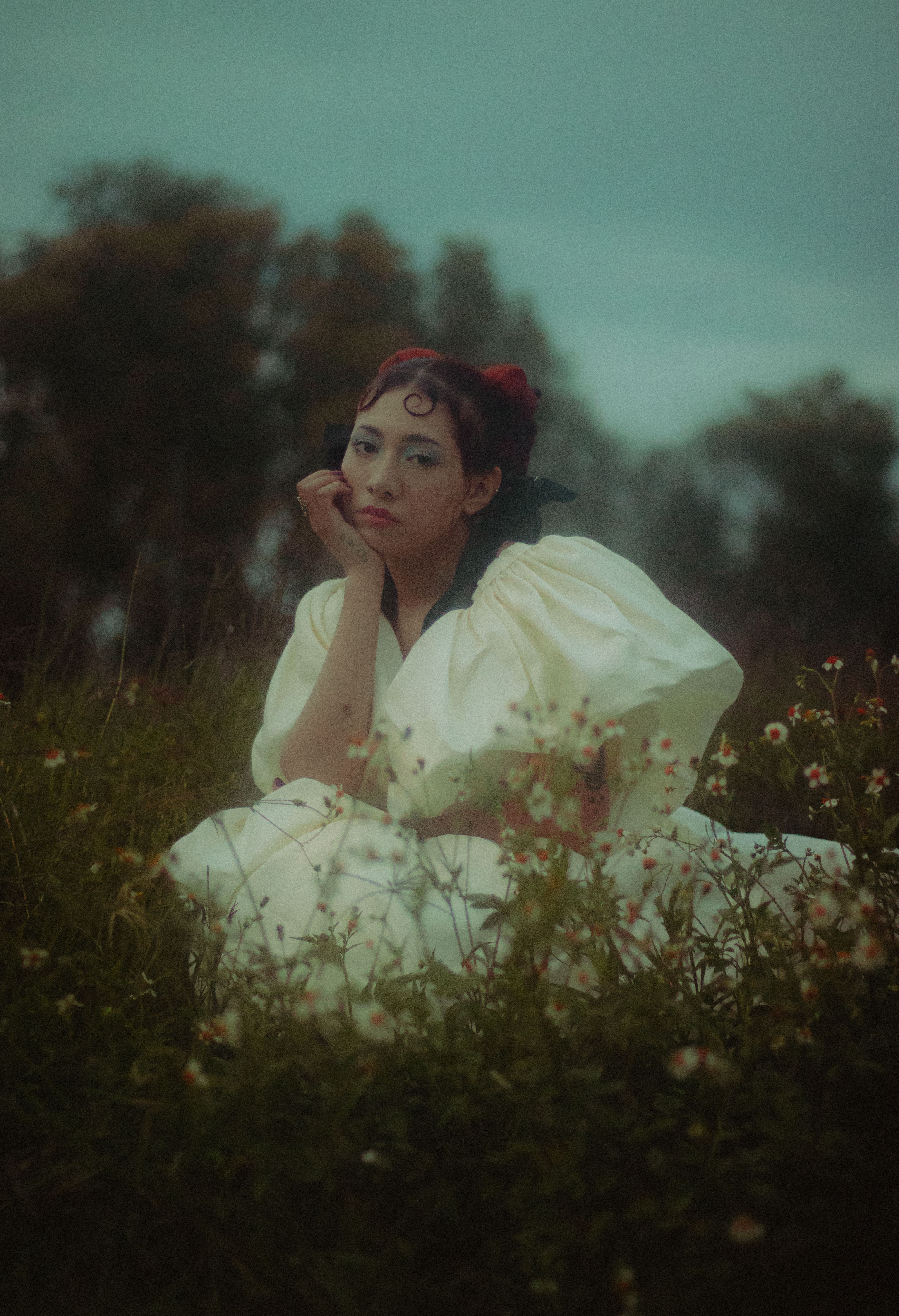 Woman in White Dress Sitting on Meadow · Free Stock Photo