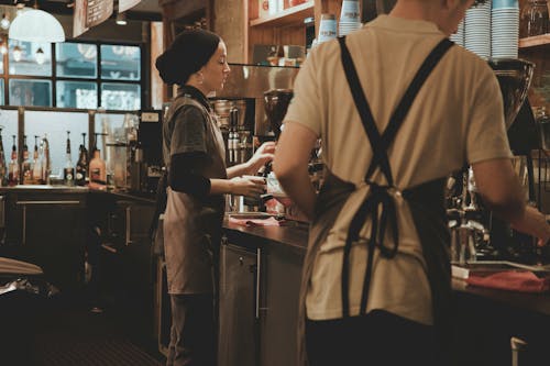Baristas Preparing Coffee in a Cafe 