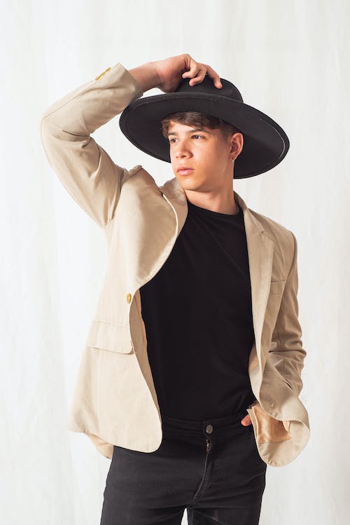 Young Model in a Black Hat and a Beige Jacket