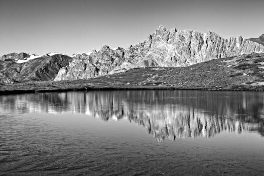 Captivating black and white reflection of mountains in Briançon, France.
