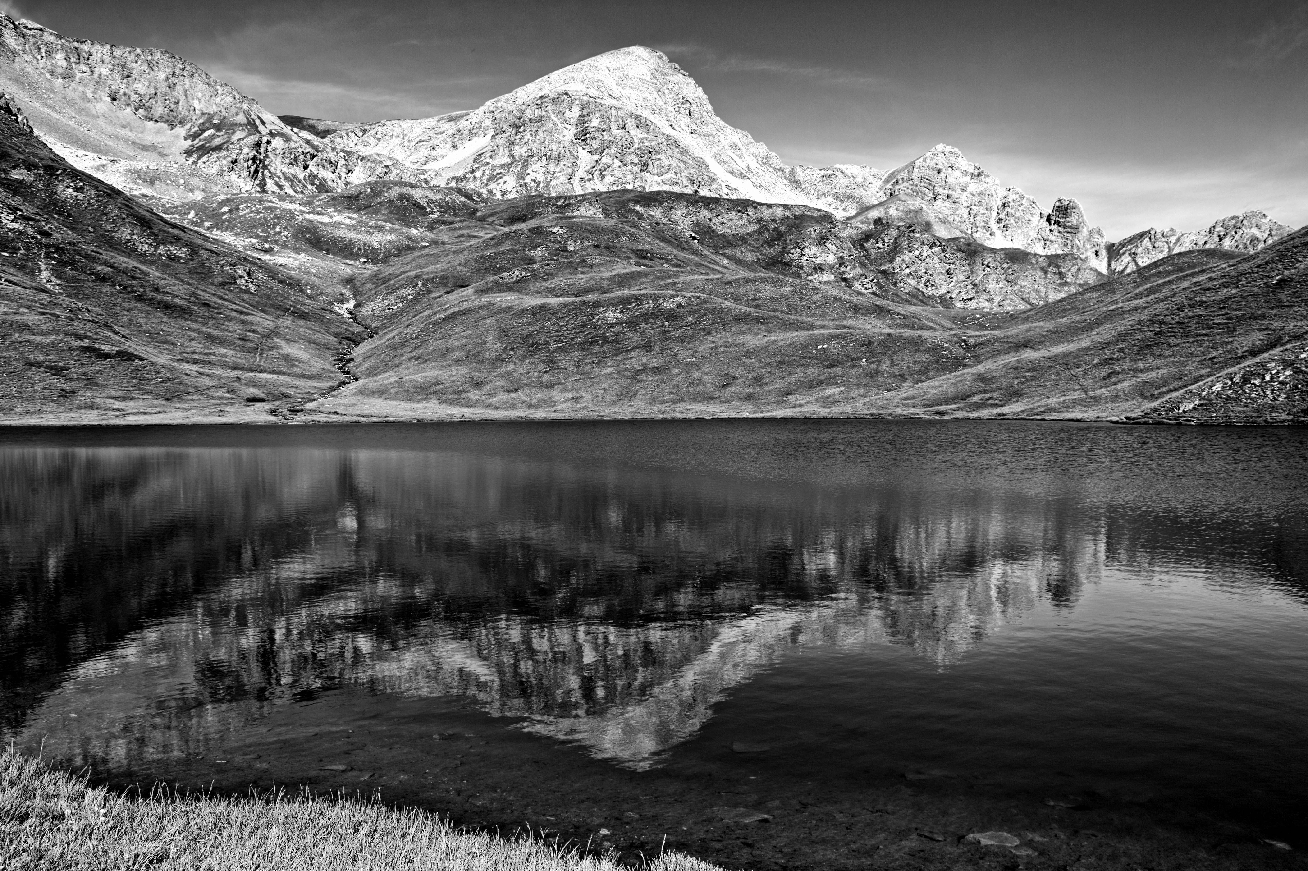 Black and White Photo of Mountains and a Lake · Free Stock Photo